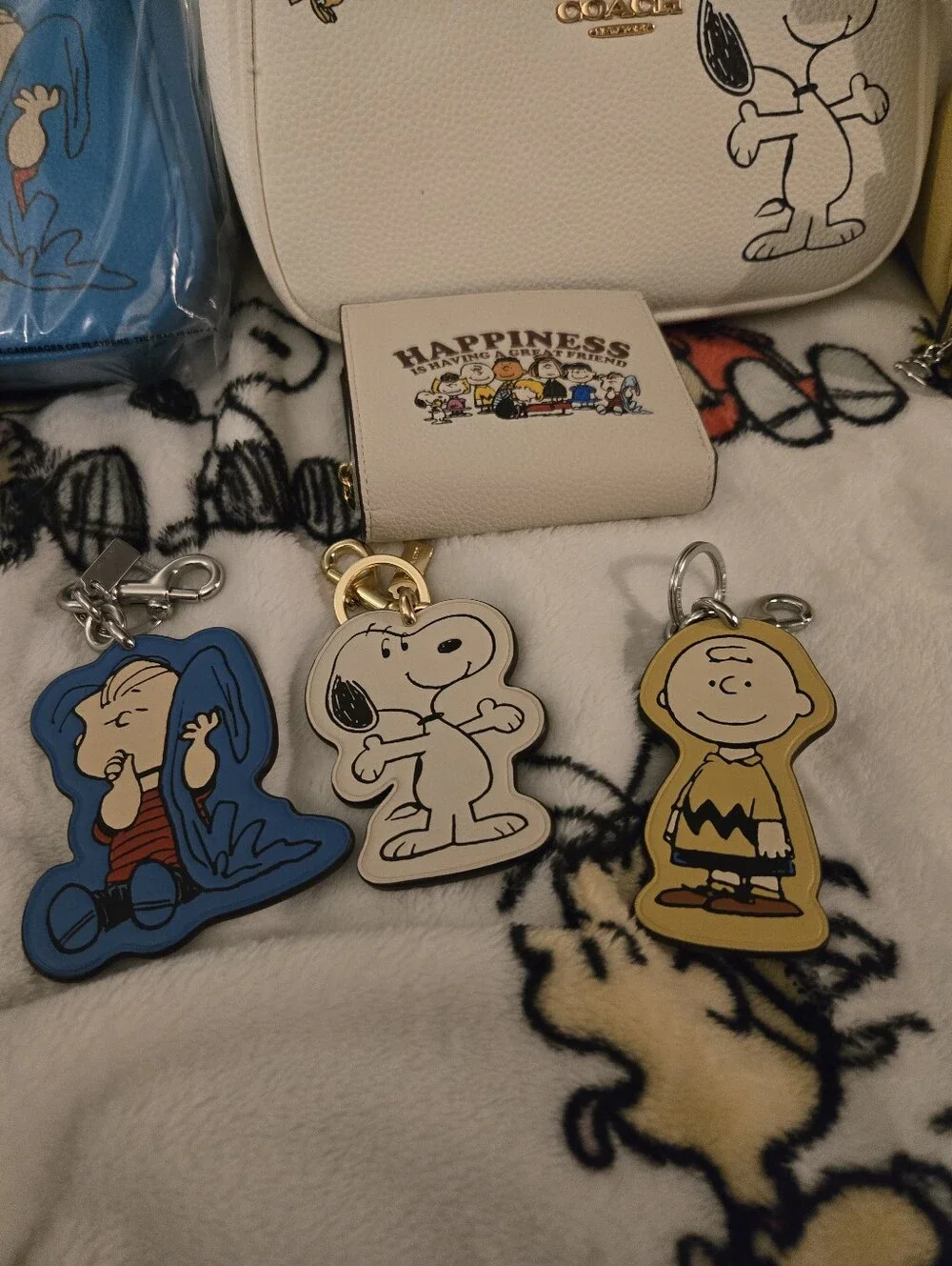 Coach Snoopy Collection Mini Bags & Wallets in White, Yellow, Blue, Cream